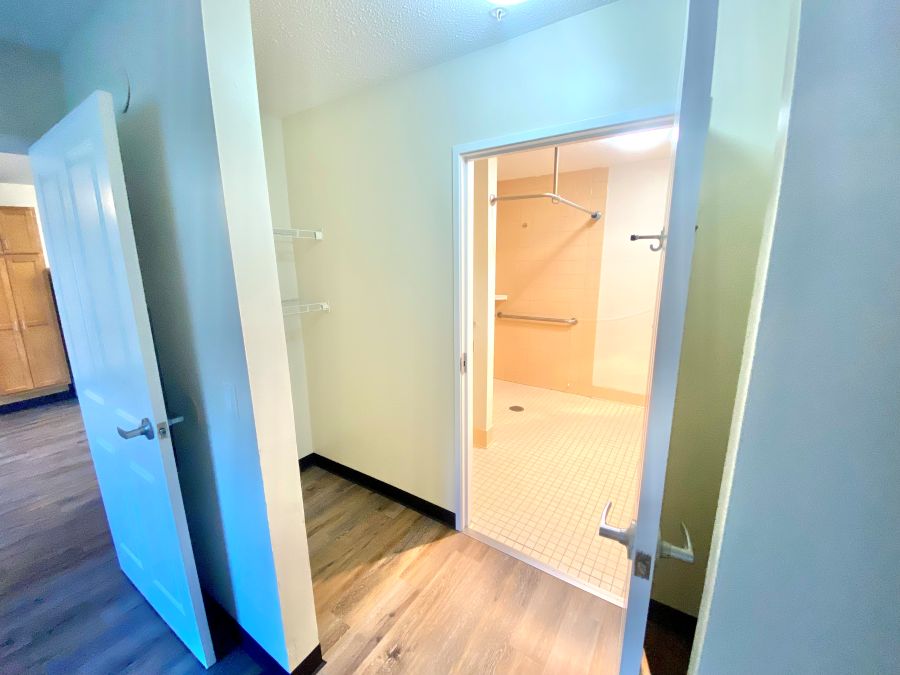 Closet space leading to the bathroom