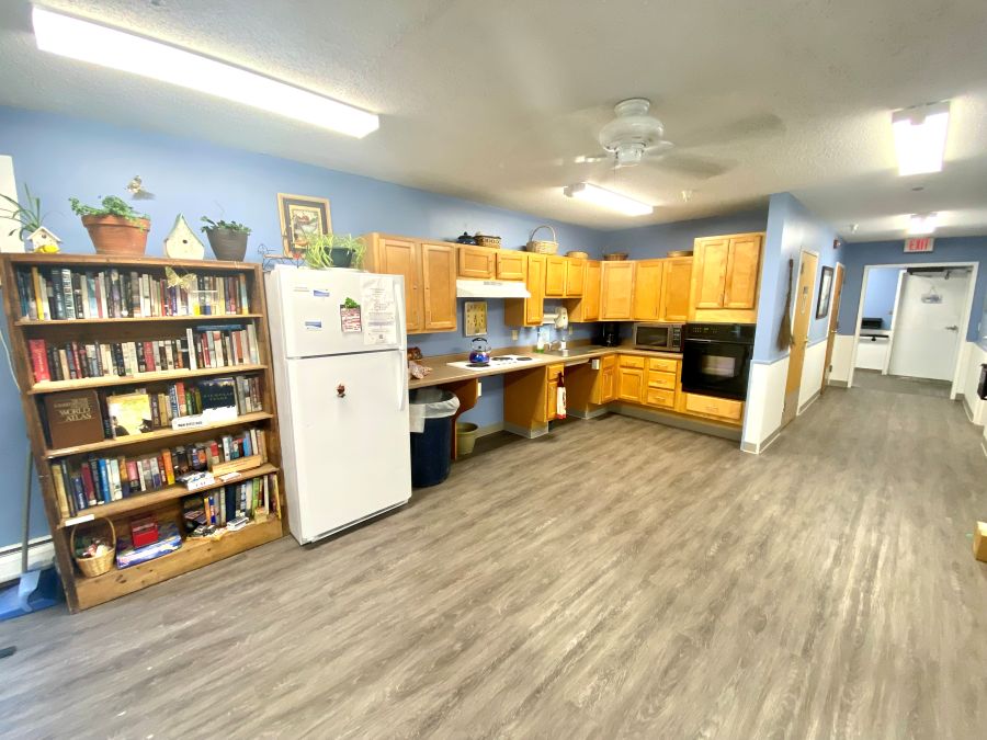 Kitchen area and bookshelf