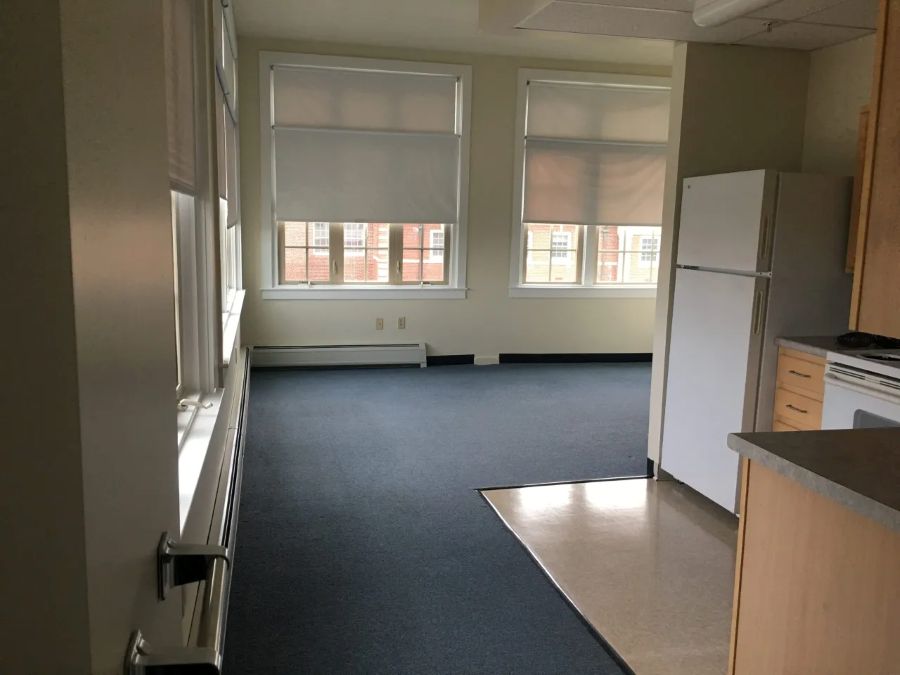 Kitchen on the right leading into the living space