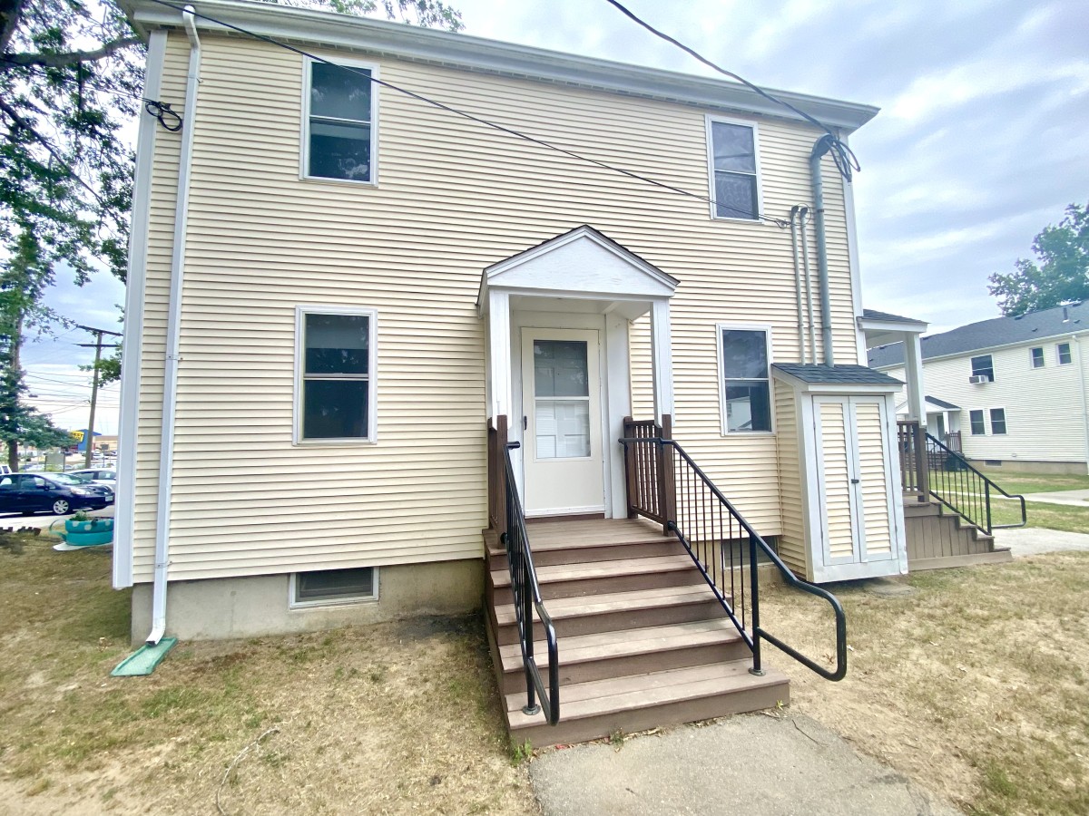 Stairs and door leading to the apartment