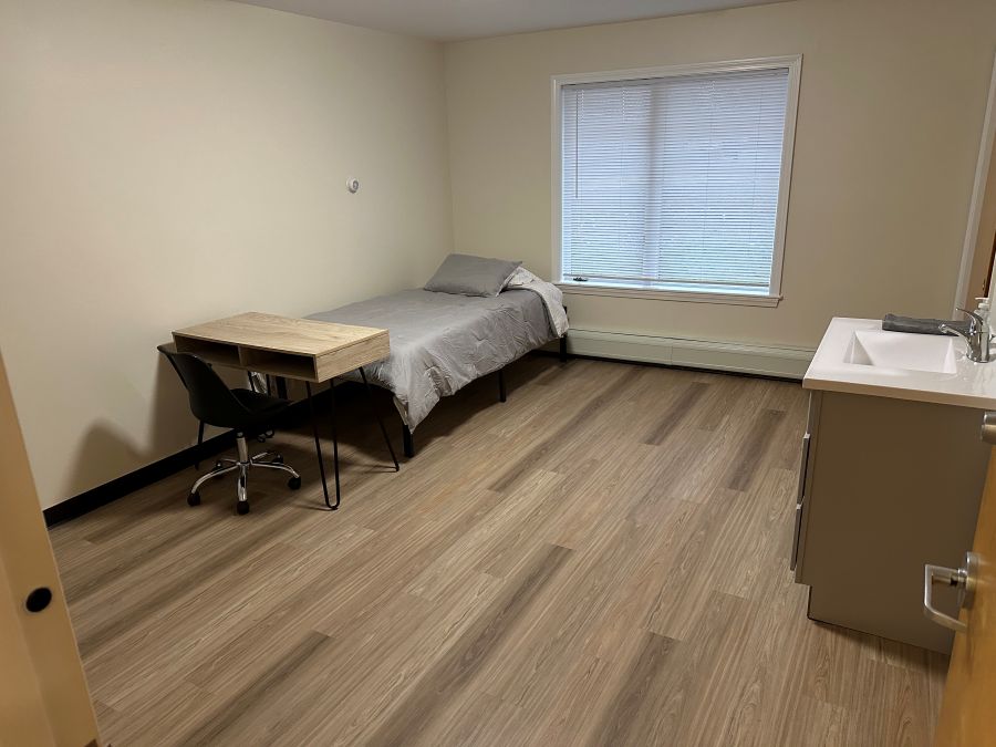Bedroom with bed and desk set up