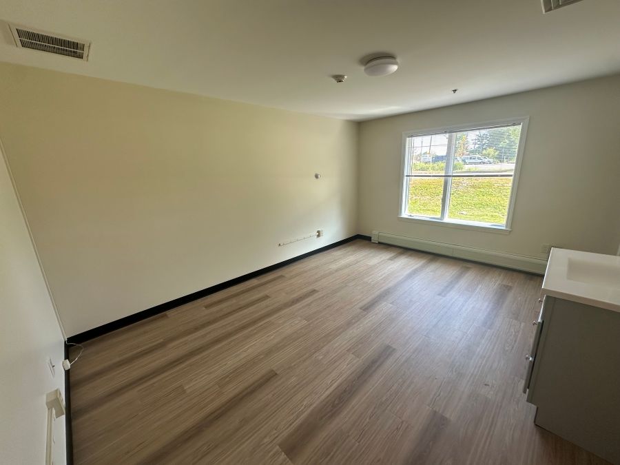 Empty living area from inside unit