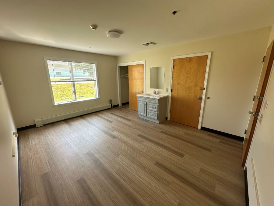 Empty living area from inside unit to the side