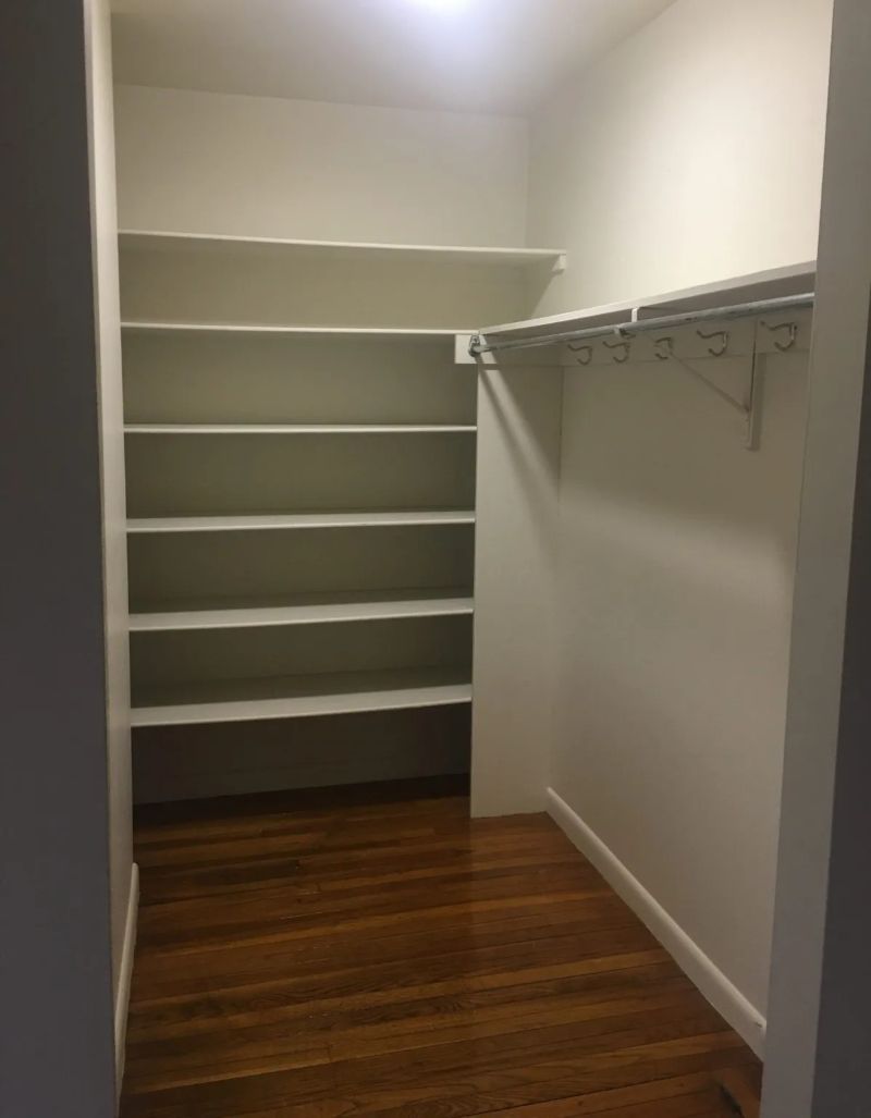 Closet with shelves and hanging bar